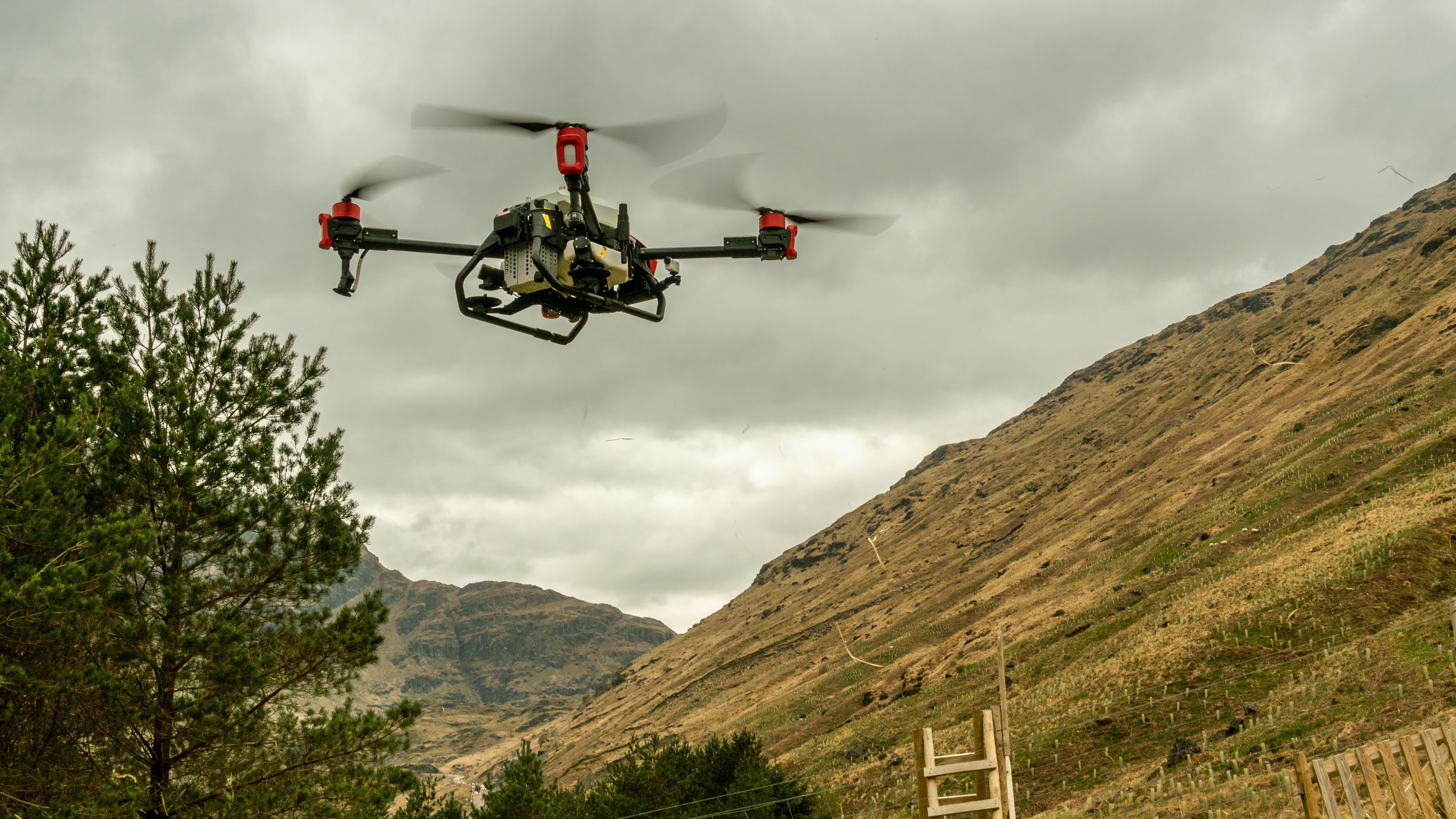 a drone next to a hillside