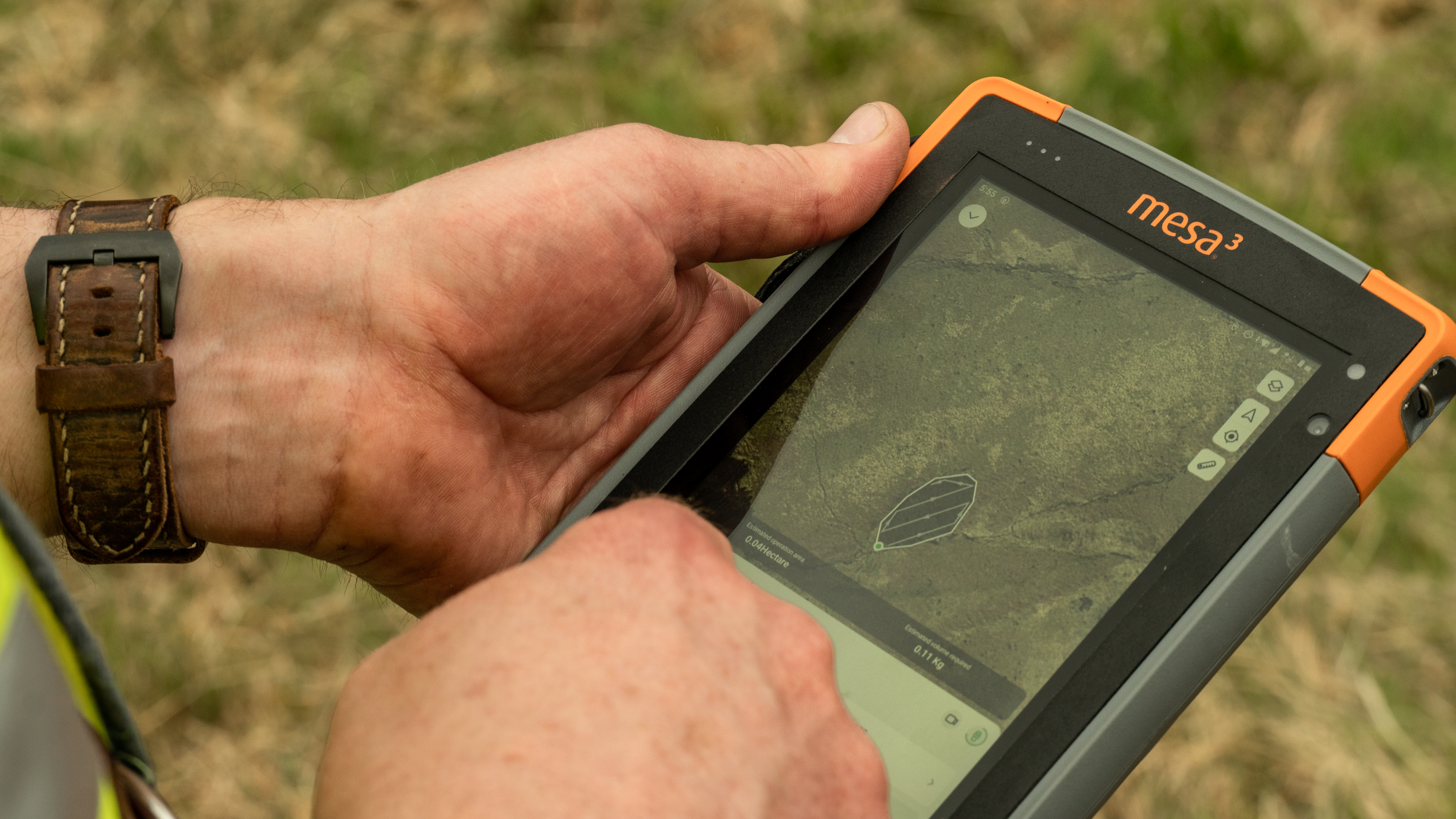 someone holding a handheld computer with a map
